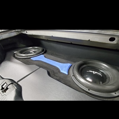 A close-up view of a car trunk with two large subwoofers installed in a custom enclosure featuring a blue accent in the center.