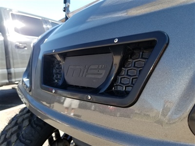 Close-up of a custom black front grille on a gray vehicle, featuring the "MIS" logo.